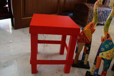 A red stool: Before and after